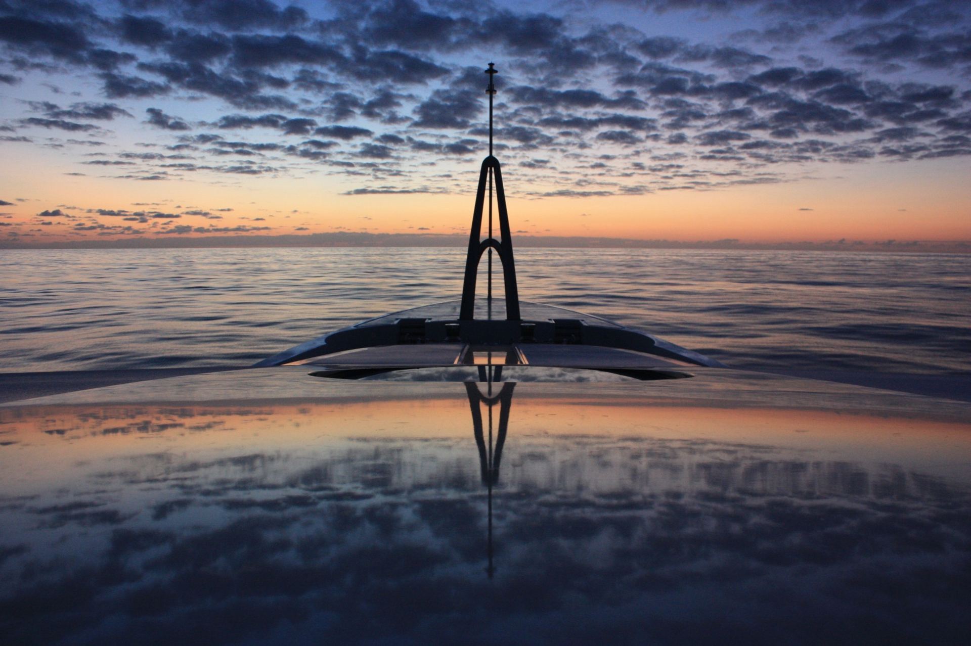 Superyacht at sea at sunset — professional intelligence for the superyacht industry
